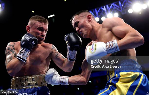 Josh Warrington and Carl Frampton exchange punches during the IBF World Featherweight Championship title fight between Josh Warrington and Carl...