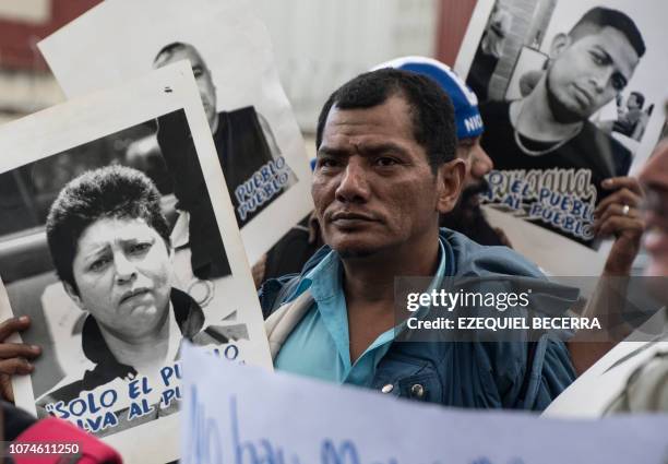 Nicaraguans demonstrate outside the Nicaraguan embassy in San Jose, Costa Rica on December 22 to protest against the arrest of opposition journalists...