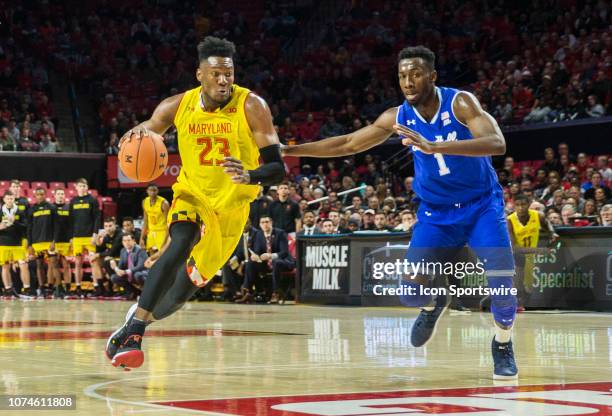 Maryland Terrapins forward Bruno Fernando bursts past Seton Hall Pirates forward Michael Nzei during a men's college basketball game between the...