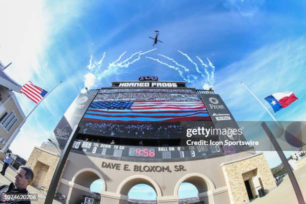 Army helicopters fly over the stadium prior to the Armed Forces Bowl between Houston and Army on December 22, 2018 at Amon G. Carter Stadium in Fort...