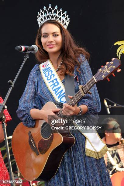 Miss France 2019 Vaimalama Chaves plays guitar on stage during a welcoming ceremony in Papeete, on December 22, 2018 on the French Polynesian island...