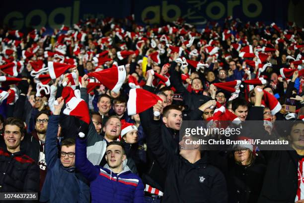 Fans watch the action during the Premier League match between Huddersfield Town and Southampton FC at John Smith's Stadium on December 22, 2018 in...