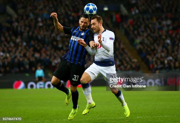 Danilo D'Ambrosio of Inter Milan battles for the ball with Christian Eriksen of Tottenham Hotspurduring the Group B match of the UEFA Champions...