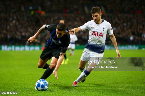 Matias Vecino of Internazionale battles for the ball with Ben Davies of Tottenham Hotspur during the Group B match of the UEFA Champions League...