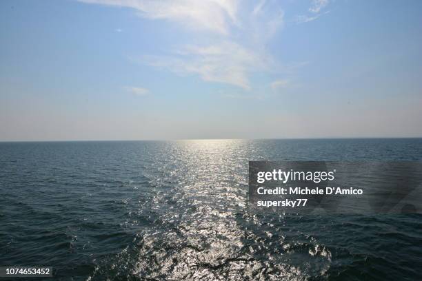 the sun reflecting on the blue lake victoria - lake victoria stock pictures, royalty-free photos & images