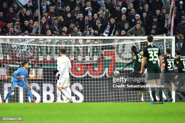 Joshua Guilavogui of Wolsfburg scores his sides first goal during the Bundesliga match between FC Augsburg and VfL Wolfsburg at WWK-Arena on December...