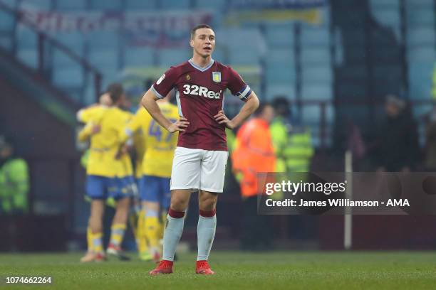 Dejected James Chester of Aston Villa after Kemar Roofe of Leeds United scores a goal to make it 3-2 during the Sky Bet Championship match between...