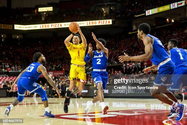 Maryland Terrapins guard Anthony Cowan Jr. Attempts a pass guided by Seton Hall Pirates guard Anthony Nelson during a men's college basketball game...