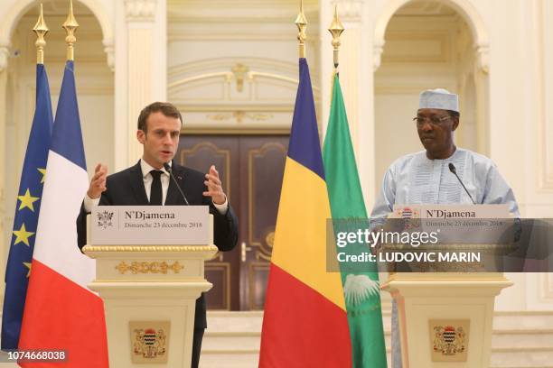 French president Emmanuel Macron and Chad's president Idriss Deby hold a press conference at the presidential palace in N'Djamena, on December 23,...