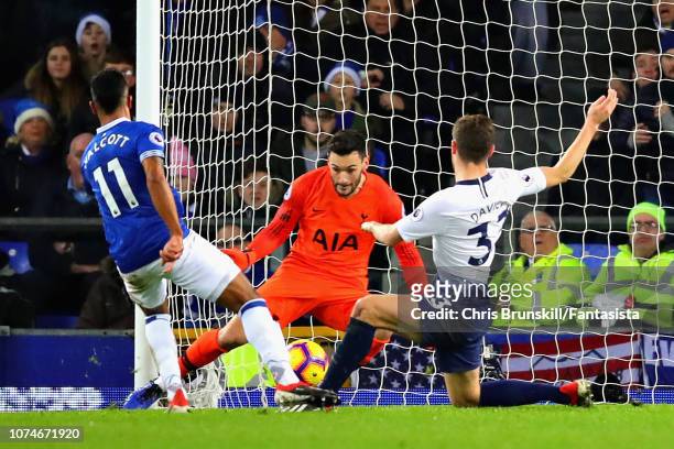 Theo Walcott of Everton scores his sides first goal during the Premier League match between Everton FC and Tottenham Hotspur at Goodison Park on...