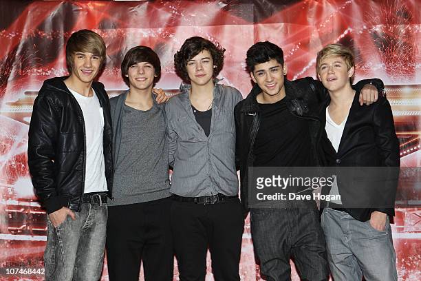 Boyband One Direction pose for a photocall to promote the X-Factor final held at The Connaught Hotel on December 9, 2010 in London, England.