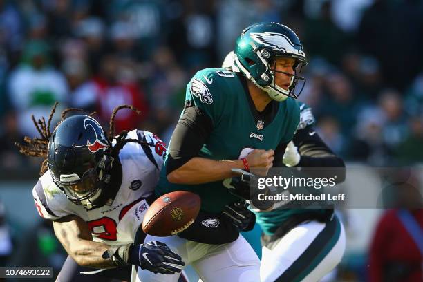 Outside linebacker Jadeveon Clowney of the Houston Texans forces a fumble on quarterback Nick Foles of the Philadelphia Eagles in the second quarter...