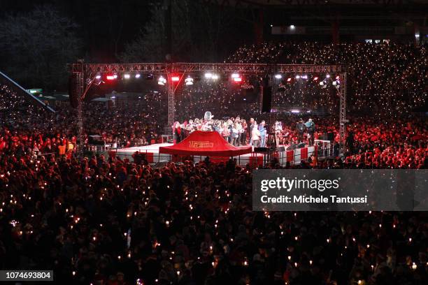 Fans of the FC Union football club gather in the club's stadium to sing Christmas carols on December 23, 2018 in Berlin, Germany. The annual...