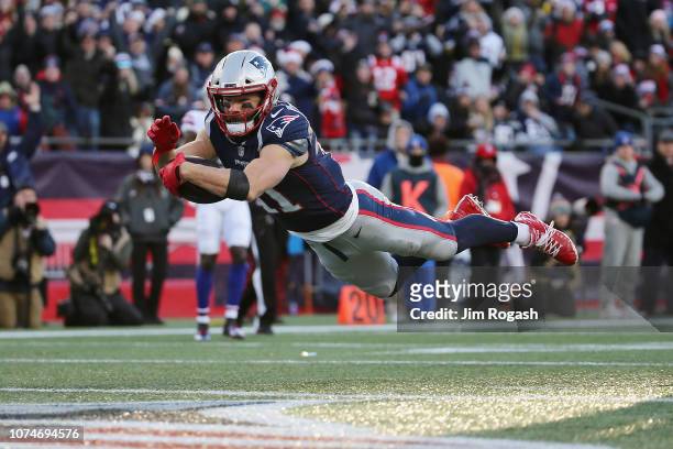Julian Edelman of the New England Patriots dives for the end zone to score a 32-yard receiving touchdown during the third quarter against the Buffalo...