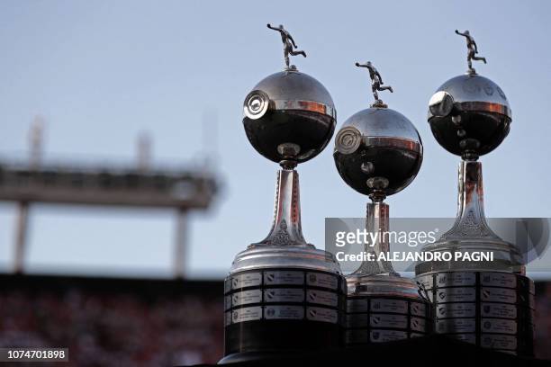 View of the three previous Copa Libertadores trophies obtained by River Plate in 1986, 1996 and 2015 at the Monumental stadium in Buenos Aires on...