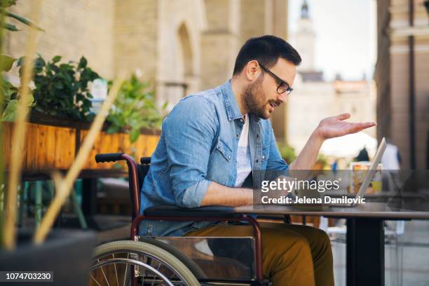 Handicapped man at cafe