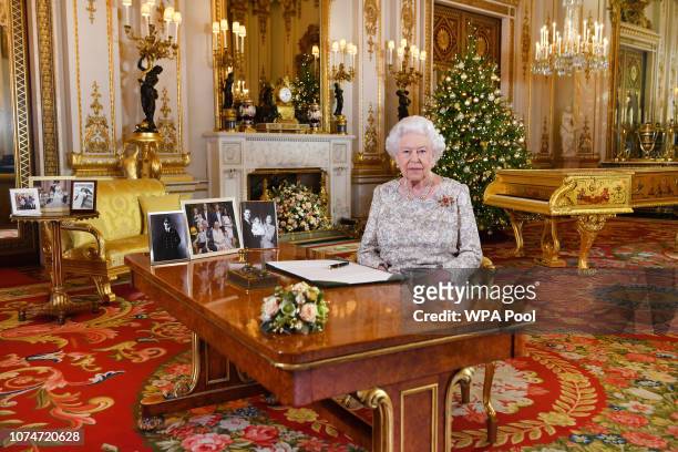 Queen Elizabeth II poses for a photo after she recorded her annual Christmas Day message, in the White Drawing Room at Buckingham Palace in a picture...