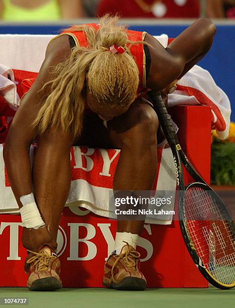 Serena Williams of the United States after injuring her right ankle during her semi final against Meghann Shaughnessy of United States during day 6...