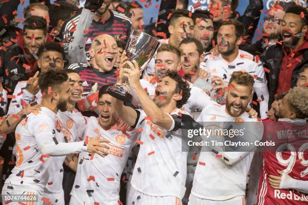 November 29: Michael Parkhurst of Atlanta United holds the Eastern Conference trophy aloft as the Atlanta team celebrate their 3-1 aggregate win...