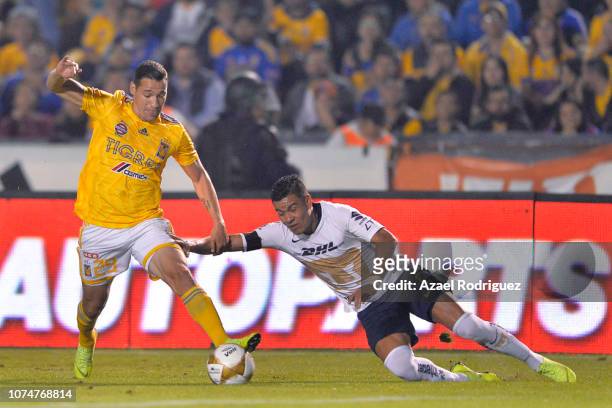 Jesús Dueñas of Tigres fights for the ball with Pablo Barrera of Pumas during the quarter finals first leg match between Tigres UANL and Pumas UNAM...
