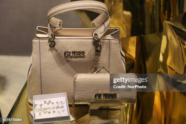 Guess brand handbags and purses on display in a shop in Toronto, Ontario, Canada.