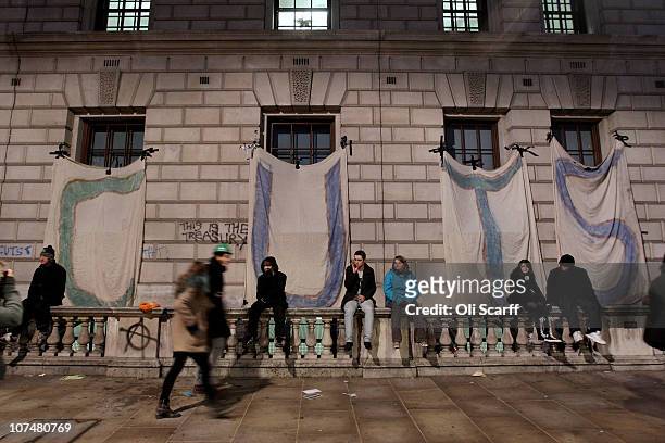 Student protesters erect banners spelling out "cuts" on the treasury building in Parliament Square on December 9, 2010 in London, England. Parliament...