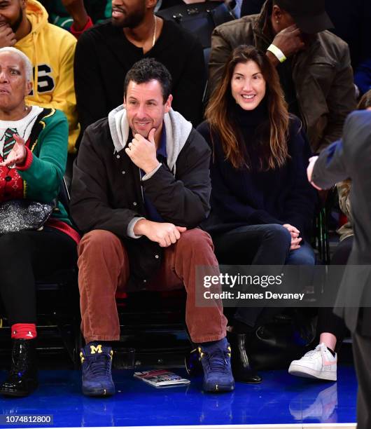 Adam Sandler and Jackie Sandler attend Milwaukee Bucks v New York Knicks game at Madison Square Garden on December 25, 2018 in New York City.