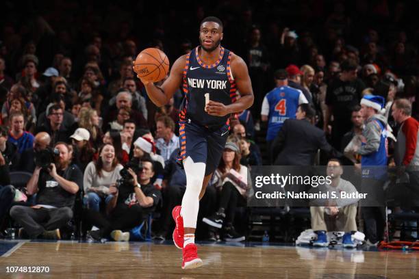 Emmanuel Mudiay of the New York Knicks dribbles the ball during the game against the Milwaukee Bucks on December 25, 2018 at Madison Square Garden in...
