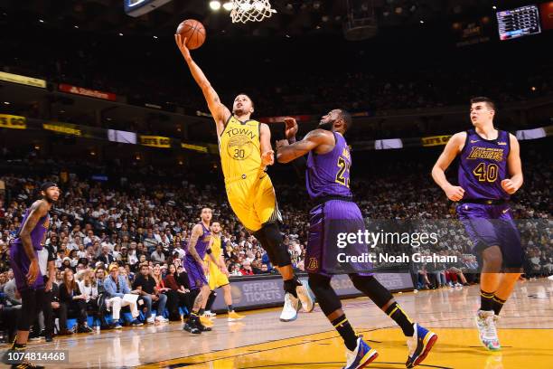 Stephen Curry of the Golden State Warriors shoots the ball against the Los Angeles Lakers on December 25, 2018 at ORACLE Arena in Oakland,...