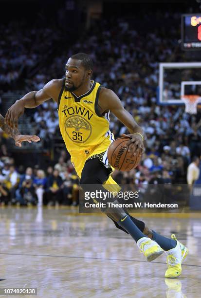 Kevin Durant of the Golden State Warriors drives towards the basket against the Los Angeles Lakers during the second half of their NBA Basketball...