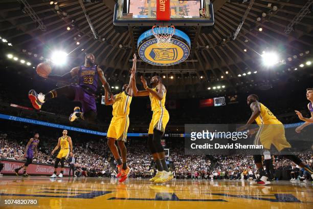 LeBron James of the Los Angeles Lakers passes the ball against the Golden State Warriors on December 25, 2018 at ORACLE Arena in Oakland, California....
