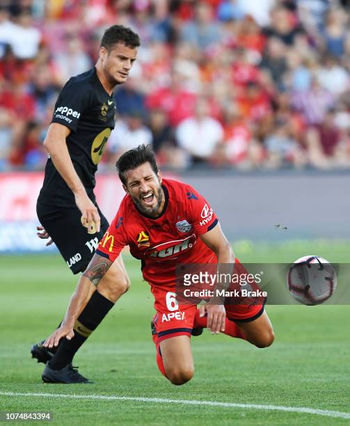 Vince Lia of Adelaide United is fouled by Oriol Riera of the Wanderers during the round nine A-League match between Adelaide United and the Western...