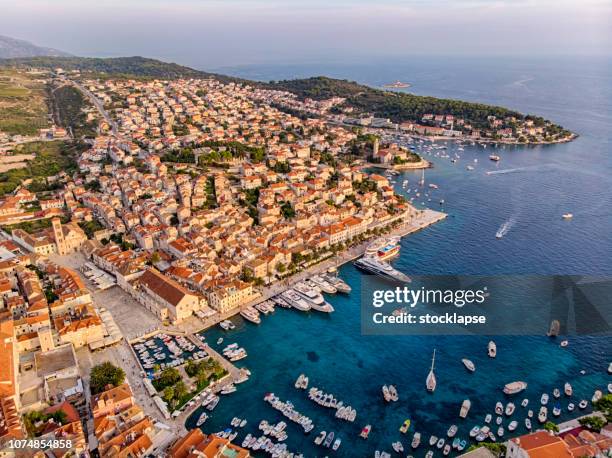 hvar city harbor at sunset light - hvar croatia stock pictures, royalty-free photos & images