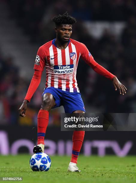 Thomas Partey of Club Atletico de Madrid runs with the ball during the Group A match of the UEFA Champions League between Club Atletico de Madrid and...