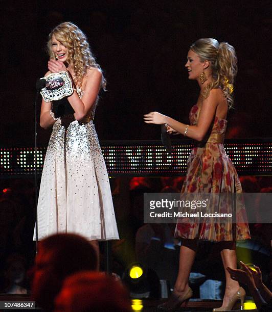 Taylor Swift accepts Breathrough Video of the Year award for "Tim McGraw" from presenter Carrie Underwood