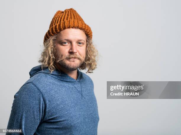 confident creative entrepreneur against white background - cool guy in hat stock pictures, royalty-free photos & images