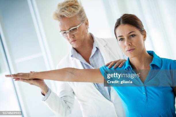 sports injury medical exam. - dislocation stock pictures, royalty-free photos & images