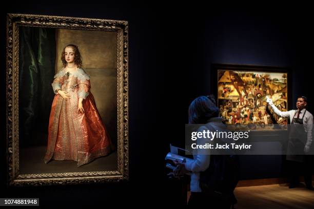 Visitors view 'Portrait of Princess Mary, Daughter of King Charles I of England', by Sir Anthony Van Dyck, 1641 during a media preview at Christie's...