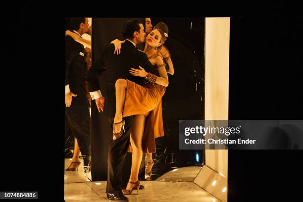 Buenos Aires, Argentina Two young Tango dancers during the show "Tango Porteno" in Buenos Aires, Argentina dancing in a spot light.