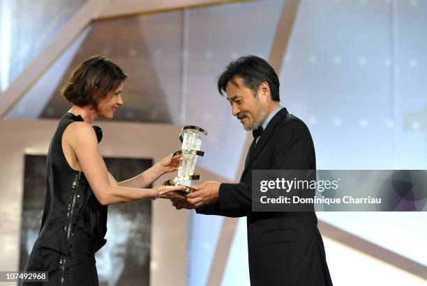 Director Kiyoshi Kurosawa awarded by French Actress Irene Jacob during the 10th Marrakech Film Festival on December 9, 2010 in Marrakech, Morocco.