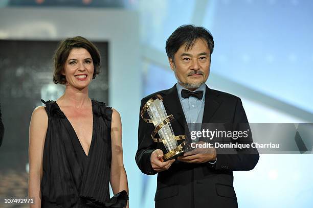 Director Kiyoshi Kurosawa awarded by French Actress Irene Jacob during the 10th Marrakech Film Festival on December 9, 2010 in Marrakech, Morocco.