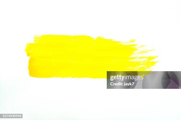yellow paint - watercolor stroke stock pictures, royalty-free photos & images
