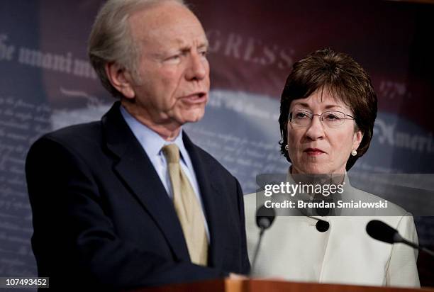 Senator Susan Collins listens while Senator Joseph Lieberman speaks during a press conference on Capitol Hill December 9, 2010 in Washington, DC. The...