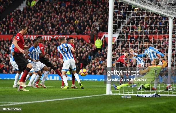 Nemanja Matic of Manchester United scores his team's first goal during the Premier League match between Manchester United and Huddersfield Town at...