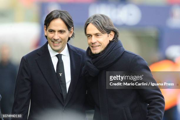 Simone Inzaghi head coach of SS Lazio and brother Filippo Inzaghi head coach of Bologna FC look on prior the beginnng of the Serie A match between...
