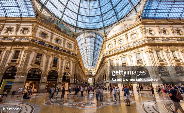 interior of the vittorio emanuele ii gallery on square duomo, in the city center of milan, italy - designer label stock pictures, royalty-free photos & images