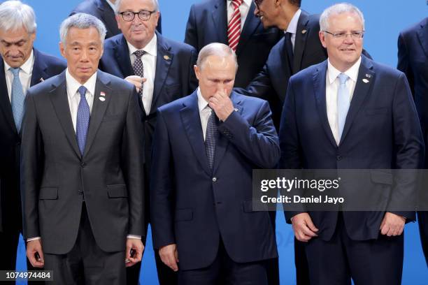 Russian President Vladimir Putin gestures during the family photo on the opening day of Argentina G20 Leaders' Summit 2018 at Costa Salguero on...