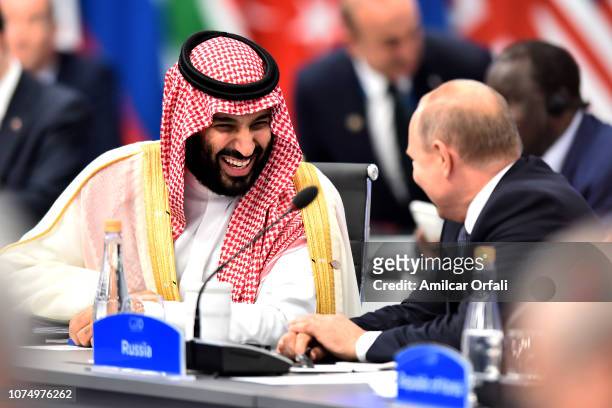 Crown Prince of Saudi Arabia Mohammad bin Salman al-Saud shares a laugh with Russian President Vladimir Putin during the opening day of Argentina G20...