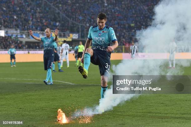 Hans Hateboer of Atalanta kicks a firework launched on the pitch during the Serie A match between Atalanta BC and Juventus at Stadio Atleti Azzurri...