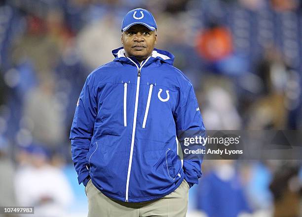 Jim Caldwell the Head Coach of the Indianapolis Colts watches his team stretch before the NFL game against the Tennessee Titans at LP Field on...